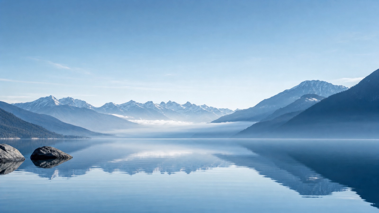 Clear blue morning across a quiet mountain lake
